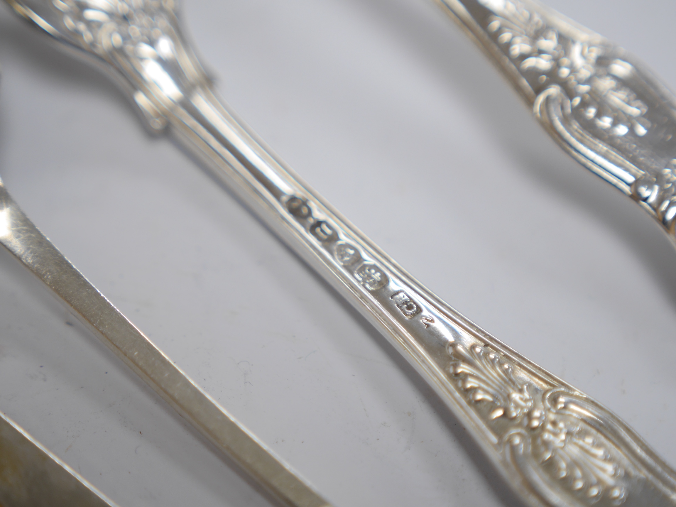 A pair of Edwardian silver grape shears, Sheffield, 1906 and four other items of silver flatware, 9oz. Condition - fair to good